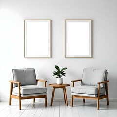 Two gray armchairs with wooden frames, a small wooden table between them, and two blank white frames on the wall above.