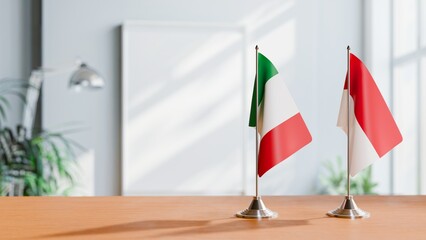 FLAGS OF ITALY AND MONACO ON TABLE