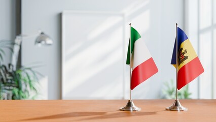 FLAGS OF ITALY AND MOLDOVA ON TABLE