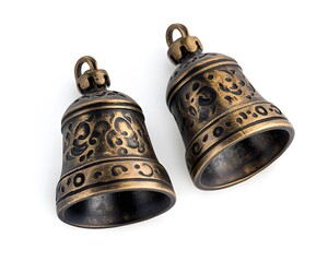 This image features beautifully crafted bronze bells, showcasing intricate designs. Perfect for illustrating cultural significance and artistic craftsmanship in various settings.