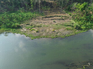 Scenic Aerial View of Lush River Valley Landscape in Spring