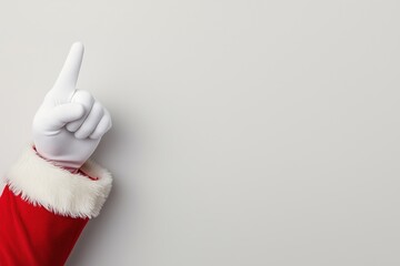 A festive hand in a red and white glove points upwards, symbolizing celebration and joy during the...