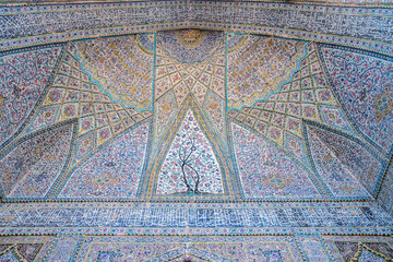 A closeup view of a stunning mosaic ceiling in Nasir ol-Molk Mosque