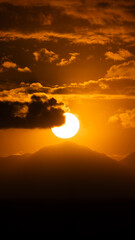 Telephoto of Sunset Behind Table Mountain in Cape Town.  Large sun photo.