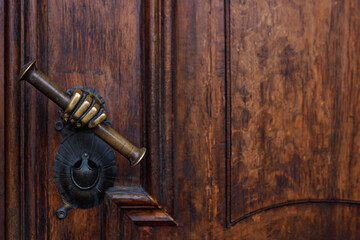 Antique italian rust brown door handle with scroll in hand