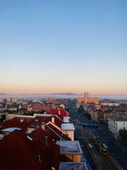 Fototapeta premium Aerial view of cityscape with red roofs and sunrise sky in Budapest, Hungary.