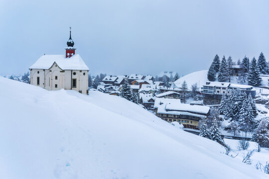Andermatt village in the swiss Alps mountains on a winter day, Switzerland