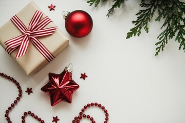 Christmas decorations on white background with gift  ornaments  and greenery.