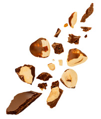 Explosion of Dark Chocolate with nuts in the air. Levitating Broken chocolate bar pieces with Hazelnuts isolated on white. Chocolate crumbs, flakes, hazel nuts  and chips