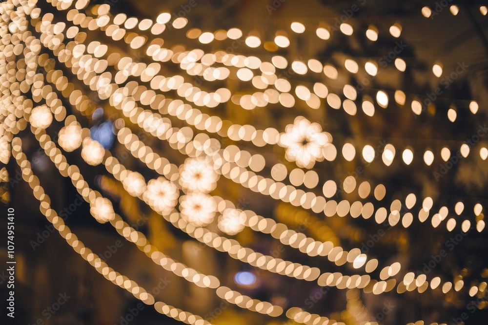 Aufkleber Abstract bokeh background of golden lights  creating a warm and festive ambiance.