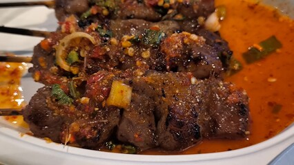 Grilled beef skewers with dipping sauce