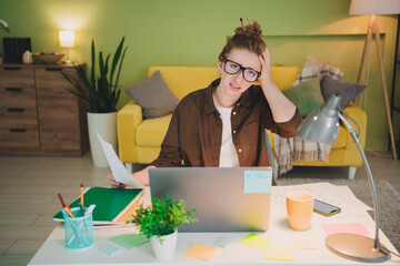 Photo of tired sad lady wear shirt eyeglasses feeling tired working hard modern device indoors workplace workshop