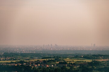 Landscape in dusk, with a pink sunset casting a warm glow over the dusty surroundings.