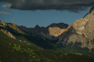 Mountains and serene wilderness bathed in sunlight, reflecting timeless natural beauty.