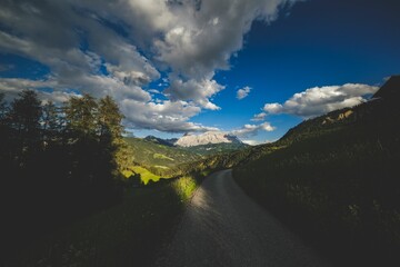 Mountains and serene wilderness bathed in sunlight, reflecting timeless natural beauty.