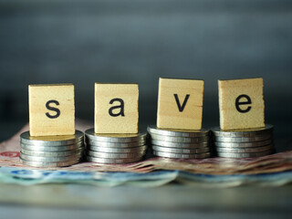 SAVE short word english letter or text in the concept of saving money and finance.Selection focus.