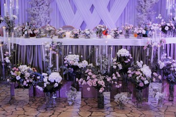 Elegant wedding table setting with flowers and candles.