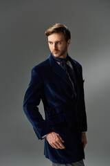 A dandy in a stylish blue velvet coat showcasing elegance in a contemporary setting