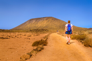 A tourist on Lobos Island on a sunny day