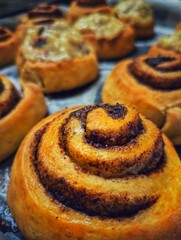 Ready-made buns with cinnamon inside and some with custard on top. Desserts - pastries.