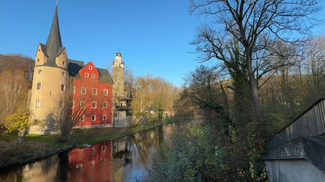 hartenstein castle stein in the autumn with river, Saxony Ore Mountains Germany 4k video