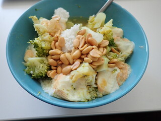 broccoli risoto with peanuts in bowl