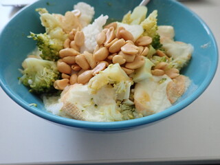 broccoli risoto with peanuts in bowl