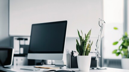 Obraz premium Modern White Office Desk with Computer, Plant, and Lamp