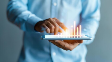 businessman using a tablet displaying a glowing digital growth chart, symbolizing data analysis, business success, and technology in finance.