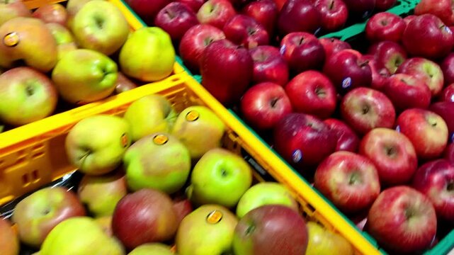 Colorful Fresh Organic Fruits in Crates at a Supermarket. Store Shelves Full of Green and Red Apples and Pears. Fruit Display in Boxes at a Local Market in Greece.
