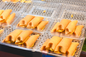 Close-up of crepe pancakes with cream filling.