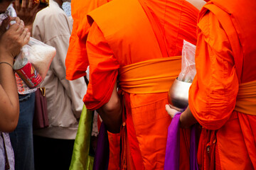 Local thai people travel visit and join rite ritual give food offerings and donate money to monk buddhism priest in Kathin ceremony celebrate Buddhist Lent at Wat Prasat temple in Nonthaburi, Thailand