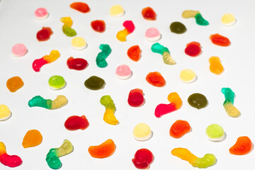 Colorful gummy candies on isolated white background