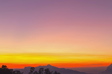 Heaven at early morning with copy space. Sunset, sunrise backdrop.Predawn clear sky with orange horizon and blue atmosphere. Smooth orange blue gradient of dawn sky.