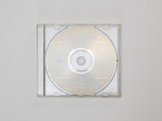 Empty CD in a transparent jewel case on a white background. Compact disc in a scratched and used plastic box. Blank template for a music EP or LP mockup.