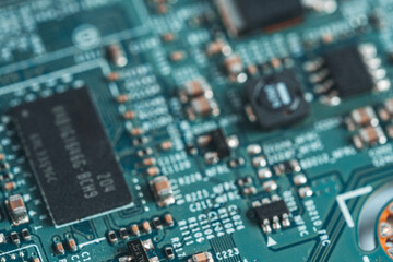 Fototapeta premium Closeup of electronic circuit board with microcircuits. Technology background.