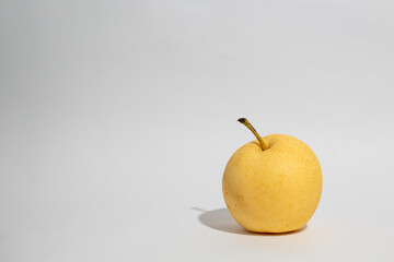 Fresh golden chinese pear on white isolated background