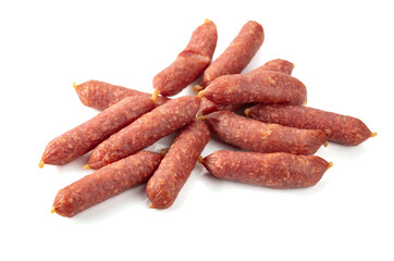 Small dry-cured sausages isolated on white.
