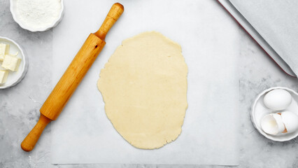 Rolled out cookie dough and rolling pin. Making different shapes of fall cookies