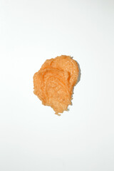 Cosmetic smear. Smears of body scrub on white background. Fruit and berry body scrub texture of swatch