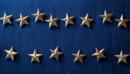 深い青のリネン風テクスチャに、星形のクリスマスオーナメントが並んだ、シンプルで洗練された冬のデザイン。
