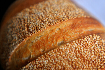 Crust with sesame seeds of home baked bread