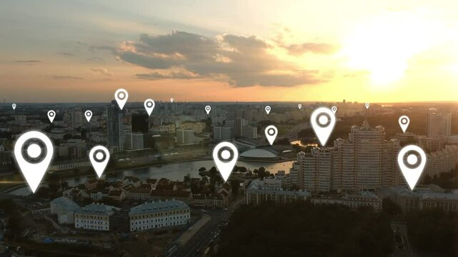 Aerial view of the city centre with location markers indicating different areas of the city. Location points are over the streets of the city. GPS point markers are animated over random buildings.