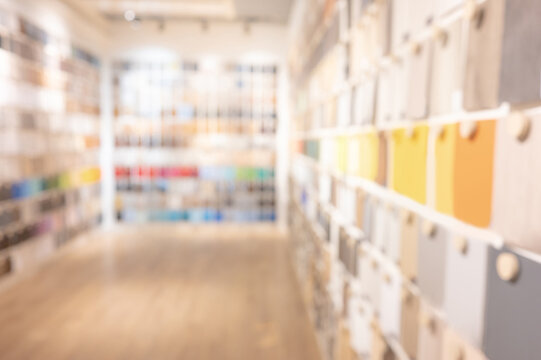 Blurred material library room. Defocused perspective of material samples collection. Blur background for architectural design and interior finishing concept