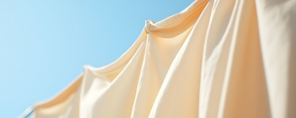 Freshly Washed Cotton Shirts Drying Outdoors - Sunlit Scene with Bright Blue Sky and Soft Shadows Creating a Clean and Inviting Atmosphere