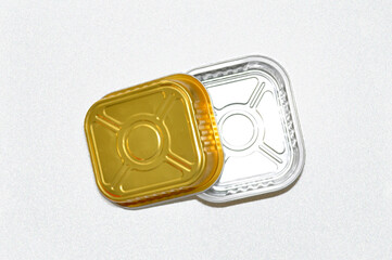 mockup of a little gold metal container on white background