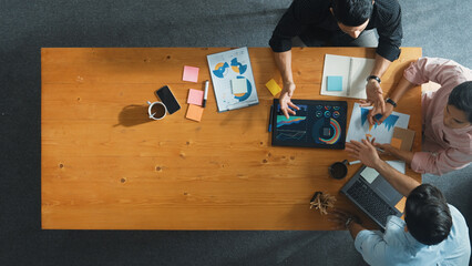 Executive manager explain financial graph to colleague at meeting room. Top aerial view of diverse...