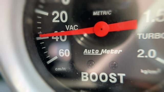 Close up of the car turbo meter.Turbo boost gauge.The turbo pressure gauge is in vacuum mode.