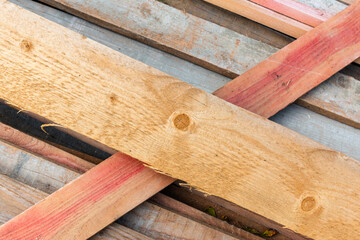 Stack of wooden boards at a sawmill, background texture