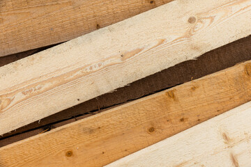 Stack of new pine wood boards, background texture